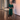 Female wearing a Green Color Kurta made from Cotton Slub Fabric.Solid print made in Straight style with Round neckline, No Collar collar,  lapel,  suitable for All Year and Casual occasion.