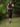 Female wearing a Black Solid Color Western Halterneck Neckline Top