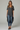 Female wearing a Black Solid Color   Fusion Style V-Neck Neckline Cotton Slub Tunic