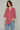 Female wearing a Peach Solid Color   Fusion Style V-Neck Neckline Cotton Slub Tunic