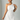Female wearing a White Solid Color Bodycan Asymmetric Neckline Dress