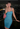 Female wearing a Ferozi Blue Solid Color Bodycan Square Neckline Dress