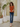 Female wearing a Orange Solid Color   Fusion Style V-Neck Neckline Cotton Slub Tunic