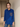 Female wearing a Blue Solid Color Fitted Notched Neckline Pointed Or Barrymore Collar Shirt
