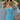 Female wearing a Ferozi Blue Solid Color A-Line Halterneck Neckline Dress