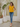 Female wearing a Yellow Solid Color   Fusion Style Asymmetric Neckline Cotton Slub Tunic