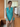 Female wearing a Ferozi Blue Solid Color Fusion Notched Neckline Notched Collar Tunic