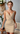 Female wearing a Beige Solid Color Wrap V-Neck Neckline Dress