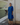 Female wearing a Blue Solid Color   Kurta Style Round Neckline Cotton Slub Shirt
