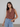 Female wearing a Rust Warli Print Fusion V-Neck Neckline Shawl Collar Tunic