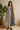Female wearing a Black And White Leaf Asymmetrical  Print A-Line V-Neck Neckline Open Collar Dress