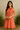 Female wearing a Orange White Daisy Flower Print Babydoll Dress