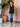 Female wearing a Black Solid Color   Fusion Style V-Neck Neckline Cotton Slub Tunic