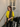 Female wearing a Yellow Solid Color Fusion Round Neckline Mandarin Collar Tunic