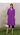 Female wearing a Purple Solid Color Kurta V-Neckline Neckline No Collar Shirt