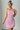 Female wearing a Baby Pink Solid Color Bodycan Asymmetric Neckline Dress