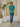Female wearing a Green Solid Color   Fusion Style V-Neck Neckline Cotton Slub Top