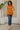 Female wearing a Orange Solid Color   Fusion Style Cowl Neckline Cotton Slub Tunic