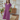 Female wearing a Muted Purple Solid Color Peplum V-Neck Neckline Dress