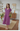 Female wearing a Muted Purple Solid Color Peplum V-Neck Neckline Dress
