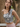 Female wearing a Grey Sanganeri, White Floral Butta Print Fusion One-Shoulder Neckline No Collar Top