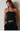 Female wearing a Black Solid Color Western Halterneck Neckline Top