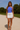 Female wearing a Ferozi Blue Solid Color Western Asymmetric Neckline Top