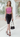 Female wearing a Pink Solid Color Western Asymmetric Neckline Top