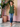 Female wearing a Green Solid Color   Fusion Style V-Neck Neckline Cotton Slub Tunic