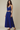 Female wearing a Blue Solid Color   Fusion Style Cowl Neckline Cotton Slub Top