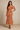 Female wearing a Peach Sanganeri, Floral Jaal Butta Print Bodycan Dress