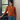Female wearing a Rust Solid Color Fusion V-Neck Neckline Shawl Collar Top