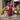 Female wearing a Pink Solid Color   A-Line Style Asymmetric Neckline Cotton Slub Kurta