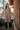 Female wearing a Off-White Maroon Butti Print Kurta V-Neckline Neckline Shirt