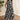 Female wearing a Black And White Leaf Asymmetrical  Print A-Line Slashed Neckline Open Collar  Dress