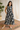 Female wearing a Black And White Leaf Asymmetrical  Print A-Line Slashed Neckline Open Collar  Dress