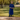 Female wearing a Blue Solid Color   Kurta Style High / Bottle Neckline Cotton Slub Shirt