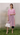 Female wearing a Pink Solid Color Kurta V-Neckline Neckline Shirt