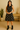 Female wearing a Black With White Flower Mughal Butti Print Babydoll Dress