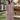 Female wearing a Off-White Sanganeri, Red Floral Geometric Jaal Butta Print A-Line Round Neckline Mandarin Collar Dress