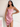 Female wearing a Baby Pink Solid Color Bodycan Dress