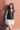 Female wearing a Black Solid Color Western V-Neck Neckline Notched Collar Top