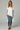 Female wearing a White Solid Color   Fusion Style V-Neck Neckline Cotton Slub Tunic