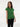 Female wearing a Green Solid Color   Fusion Style V-Neck Neckline Cotton Slub Top