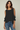 Female wearing a Black Solid Color   Western Style Round Neckline Cotton Slub Tunic