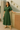 Female wearing a Greenish Rust Solid Color Shirt V-Neck Neckline Shirt Collar Dress