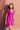 Female wearing a Pink Solid Color Empire Line V-Neck Neckline No Collar Dress