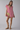 Female wearing a Baby Pink Solid Color A-Line Scoop Neckline Dress
