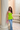 Female wearing a Leaf Green Solid Color Western Strapless Neckline Top
