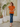 Female wearing a Orange Solid Color   Fusion Style Keyhole Neckline Cotton Slub Top